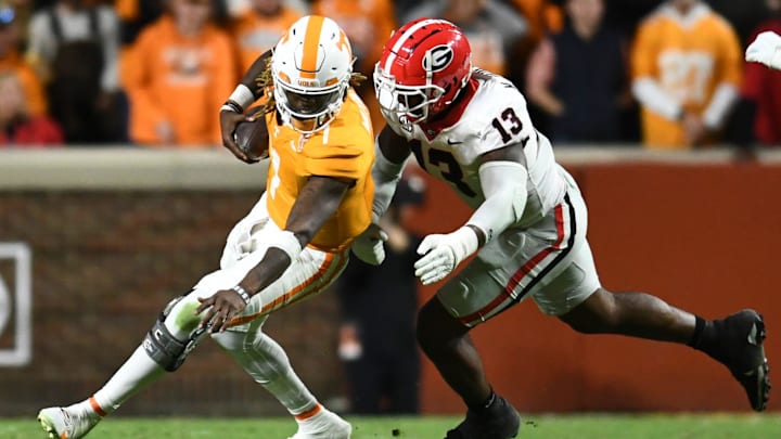 Tennessee quarterback Joe Milton III (7) is defended by Georgia defensive lineman Mykel Williams (13) during a football game between Tennessee and Georgia at Neyland Stadium in Knoxville, Tenn., on Saturday, Nov. 18, 2023. Tennessee quarterback Joe Milton III (7) is defended by Georgia defensive lineman Mykel Williams (13) during a football game between Tennessee and Georgia at Neyland Stadium in Knoxville, Tenn., on Saturday, Nov. 18, 2023.