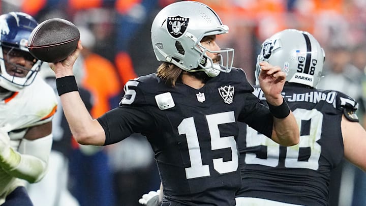 Nov 24, 2024; Paradise, Nevada, USA; Las Vegas Raiders quarterback Gardner Minshew (15) looks to throw against the Denver Broncos during the fourth quarter at Allegiant Stadium. Mandatory Credit: Stephen R. Sylvanie-Imagn Images