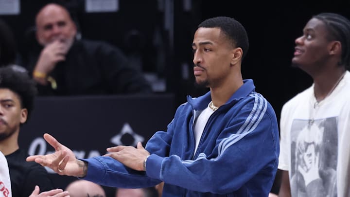 Feb 22, 2025; Salt Lake City, Utah, USA; Utah Jazz forward John Collins reacts to a play from the bench during the second half of the game against the Houston Rockets at Delta Center. Mandatory Credit: Rob Gray-Imagn Images