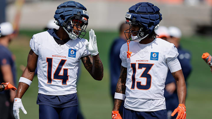 Jul 24, 2025; Englewood, CO, USA; Denver Broncos wide receiver Courtland Sutton (14) and wide receiver Pat Bryant (13) during Denver Broncos Training Camp. Jul 24, 2025; Englewood, CO, USA; Denver Broncos wide receiver Courtland Sutton (14) and wide receiver Pat Bryant (13) during Denver Broncos Training Camp.