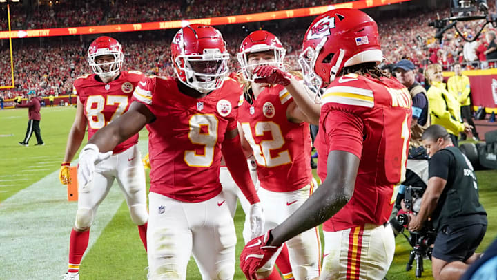 Oct 7, 2024; Kansas City, Missouri, USA; Kansas City Chiefs wide receiver Xavier Worthy (1) celebrates with wide receiver JuJu Smith-Schuster (9) and running back Carson Steele (42) after scoring a touchdown against the New Orleans Saints during the second half at GEHA Field at Arrowhead Stadium. Mandatory Credit: Denny Medley-Imagn Images