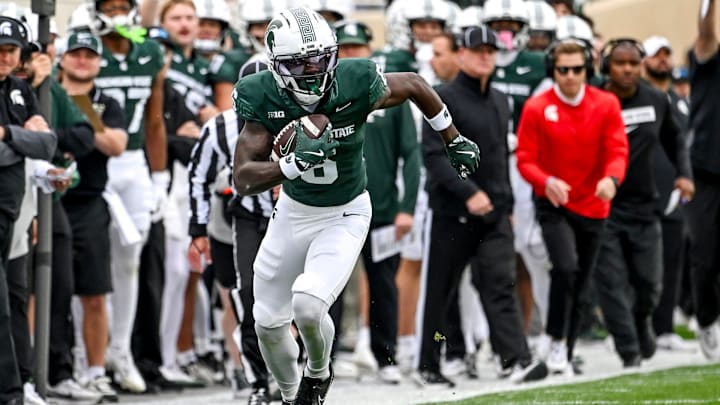 Michigan State's Nick Marsh, left, runs after a catch against UCLA during the first quarter on Saturday, Oct. 11, 2025, at Spartan Stadium in East Lansing. Michigan State's Nick Marsh, left, runs after a catch against UCLA during the first quarter on Saturday, Oct. 11, 2025, at Spartan Stadium in East Lansing.