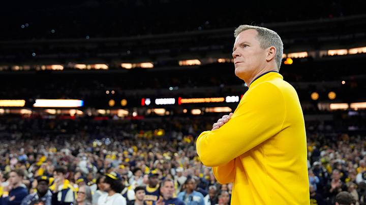 Michigan head coach Dusty May looks on from the court ahead of the NCAA national championship game against Connecticut at Lucas Oil Stadium in Indianapolis on Monday, April 6, 2026. Michigan head coach Dusty May looks on from the court ahead of the NCAA national championship game against Connecticut at Lucas Oil Stadium in Indianapolis on Monday, April 6, 2026.