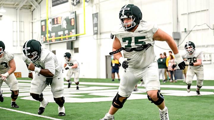 Michigan State's Ben Murawski and the rest of the offensive line participate in a drill during spring football practice on Tuesday, April 14, 2026, in East Lansing.