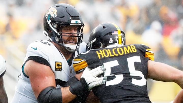 Oct 29, 2023; Pittsburgh, Pennsylvania, USA;  Jacksonville Jaguars guard Brandon Scherff (68) blocks Pittsburgh Steelers linebacker Cole Holcomb (55) at the line of scrimmage during the second quarter at Acrisure Stadium. Mandatory Credit: Charles LeClaire-Imagn Images