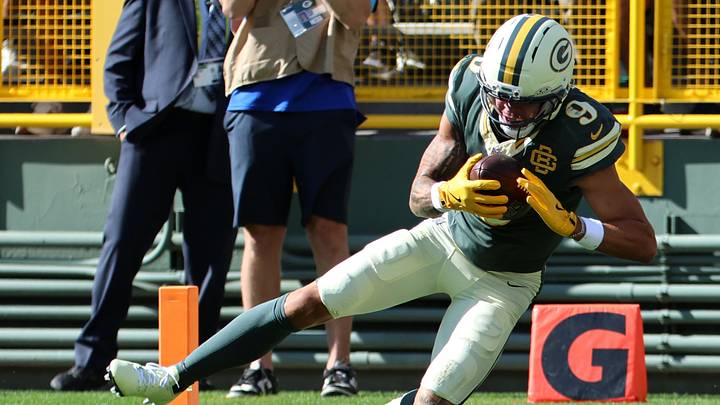 Green Bay Packers wide receiver Christian Watson (9) carries a touchdown pass to start the game against Chicago. Green Bay Packers wide receiver Christian Watson (9) carries a touchdown pass to start the game against Chicago.