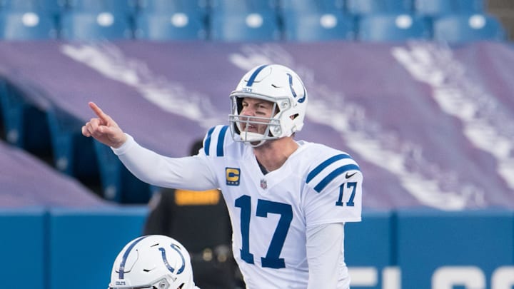 Jan 9, 2021; Orchard Park, New York, USA; Indianapolis Colts quarterback Philip Rivers (17) and center Ryan Kelly (78) at the line of scrimmage in the third quarter wildcard playoff game against the Buffalo Bills at Bills Stadium. Mandatory Credit: Mark Konezny-Imagn Images