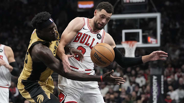 Nov 24, 2023; Toronto, Ontario, CAN; Toronto Raptors forward Pascal Siakam (43) and Chicago Bulls guard Zach LaVine (8) battle for the basketball during the first half at Scotiabank Arena. Mandatory Credit: John E. Sokolowski-Imagn Images