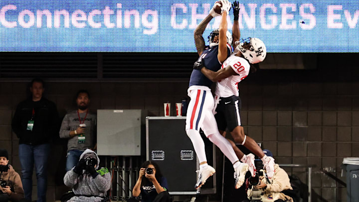 Arizona Wildcats wide receiver Tetairoa McMillan catches the ball to make a touchdown against the Houston Cougars. Arizona Wildcats wide receiver Tetairoa McMillan catches the ball to make a touchdown against the Houston Cougars.