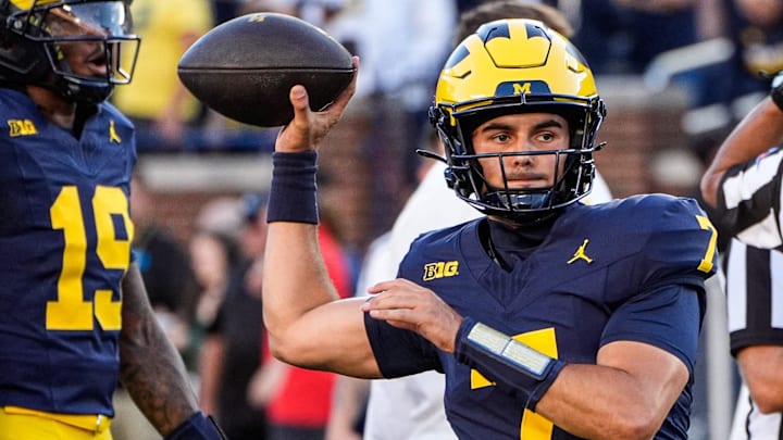 Michigan quarterback Mikey Keene (7) warms up ahead of the New Mexico game at Michigan Stadium in Ann Arbor on Saturday, August 30, 2025.