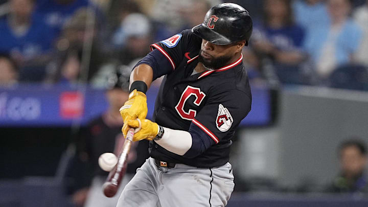 May 4, 2025; Toronto, Ontario, CAN; Cleveland Guardians designated hitter Carlos Santana (41) makes contact with the ball during the second inning against the Toronto Blue Jays at Rogers Centre. Mandatory Credit: John E. Sokolowski-Imagn Images May 4, 2025; Toronto, Ontario, CAN; Cleveland Guardians designated hitter Carlos Santana (41) makes contact with the ball during the second inning against the Toronto Blue Jays at Rogers Centre. Mandatory Credit: John E. Sokolowski-Imagn Images