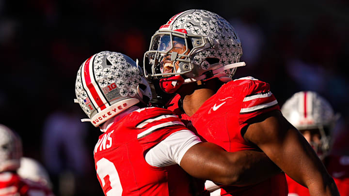 Ohio State Buckeyes safety Caleb Downs celebrates with Sonny Styles after sacking Rutgers quarterback Athan Kaliakmanis 