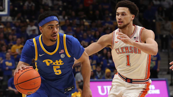 Jan 18, 2025; Pittsburgh, Pennsylvania, USA; Pittsburgh Panthers guard Ishmael Leggett (5) drives to the basket against Clemson Tigers guard Chase Hunter (1) during the first half at the Petersen Events Center. Mandatory Credit: Charles LeClaire-Imagn Images