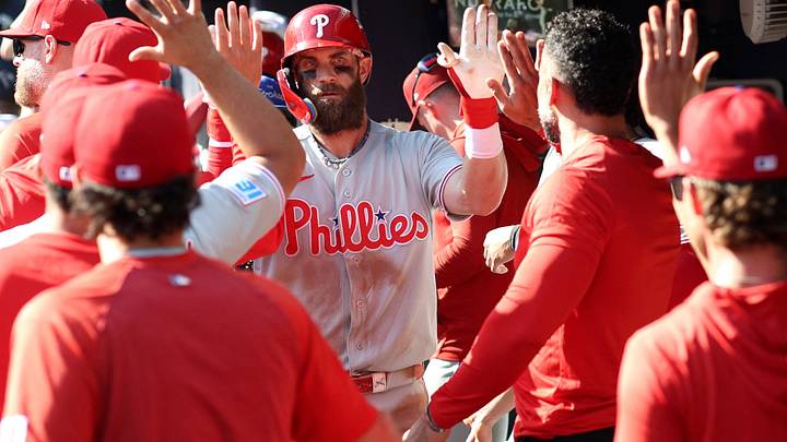 Sep 30, 2026; Cumberland, Georgia, USA; Philadelphia Phillies outfielder Bryce Harper (3) celebrates with teammates in the dugout after hitting a solo home run against the Atlanta Braves in the eighth inning during game two of the Wildcard round for the 2026 MLB Playoffs at Truist Park. Mandatory Credit: Brett Davis-Imagn Images Sep 30, 2026; Cumberland, Georgia, USA; Philadelphia Phillies outfielder Bryce Harper (3) celebrates with teammates in the dugout after hitting a solo home run against the Atlanta Braves in the eighth inning during game two of the Wildcard round for the 2026 MLB Playoffs at Truist Park. Mandatory Credit: Brett Davis-Imagn Images