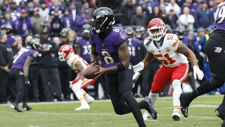 Jan 28, 2024; Baltimore, Maryland, USA; Baltimore Ravens quarterback Lamar Jackson (8) runs with the ball against the Kansas City Chiefs during the first quarter in the AFC Championship football game at M&T Bank Stadium. Mandatory Credit: Geoff Burke-USA TODAY Sports