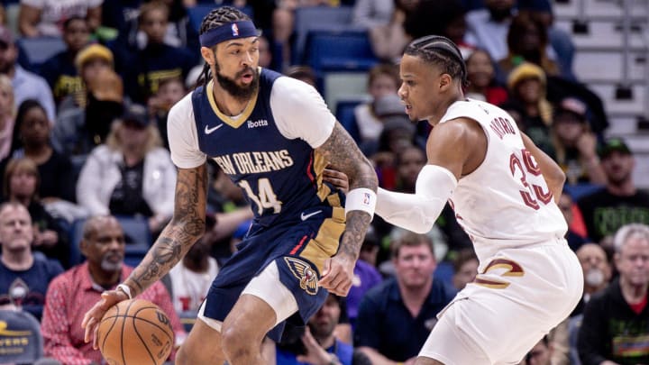 Mar 13, 2024; New Orleans, Louisiana, USA; New Orleans Pelicans forward Brandon Ingram (14) dribbles against Cleveland Cavaliers forward Isaac Okoro (35) during the first half at Smoothie King Center. Mandatory Credit: Stephen Lew-USA TODAY Sports