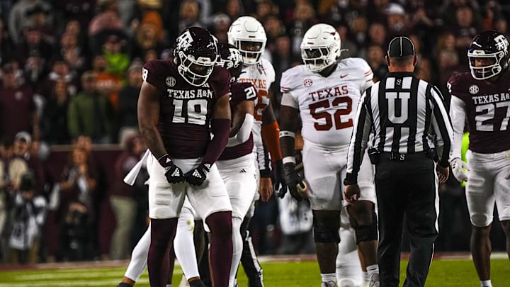 Nov 30, 2024; College Station, Texas, USA; Texas A&M defensive lineman Cashius Howell (18) celebrates a defensive stop during the Lone Star Showdown against the Texas Longhorns at Kyle Field. Mandatory Credit: Sara Diggins/USA TODAY Network via Imagn Images