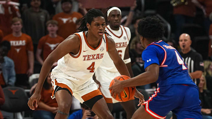 Texas Longhorns forward Jamie Vinson (4) guards Houston Christian guard Elijah Brooks (4) during the game at the Moody Center on Friday, Nov. 8, 2024 in Austin.