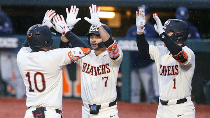 Oregon State's Bryce Hubbard (10) celebrates with his teammates AJ Singer, left, and Cooper Vance during an NCAA college baseball game at Goss Stadium on Friday, March 6, 2026, in Corvallis, Ore. Oregon State's Bryce Hubbard (10) celebrates with his teammates AJ Singer, left, and Cooper Vance during an NCAA college baseball game at Goss Stadium on Friday, March 6, 2026, in Corvallis, Ore.