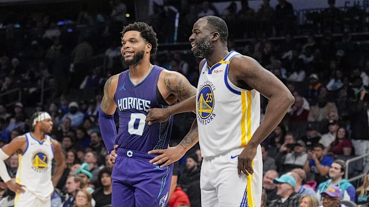 Mar 3, 2025; Charlotte, North Carolina, USA; Golden State Warriors forward Draymond Green (23) chats with Charlotte Hornets forward Miles Bridges (0) at the free throw line during the second half at Spectrum Center. Mandatory Credit: Jim Dedmon-Imagn Images Mar 3, 2025; Charlotte, North Carolina, USA; Golden State Warriors forward Draymond Green (23) chats with Charlotte Hornets forward Miles Bridges (0) at the free throw line during the second half at Spectrum Center. Mandatory Credit: Jim Dedmon-Imagn Images