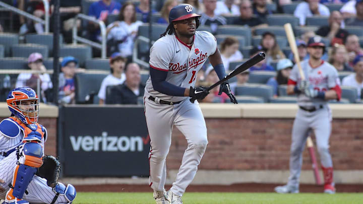 May 30, 2022; New York City, New York, USA; Washington Nationals first baseman Josh Bell (19) hits a two-RBI single in the first inning against the New York Mets at Citi Field.