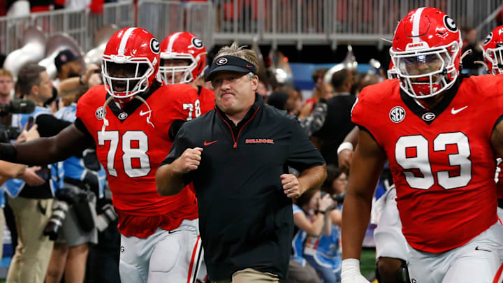 Georgia coach Kirby Smart leads his team onto the field before the start of the NCAA Aflac Kickoff Game in Atlanta, on Saturday, Aug. 31, 2024.