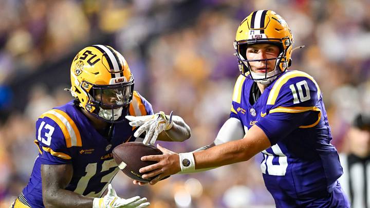 Tigers Quarterback Sam Leavitt 10 hands off to Dilin Jones 13,  LSU Tigers take on the LA Tech Bulldogs.  September 12, 2026; Baton Rouge, Louisiana, USA;  at Tiger Stadium.