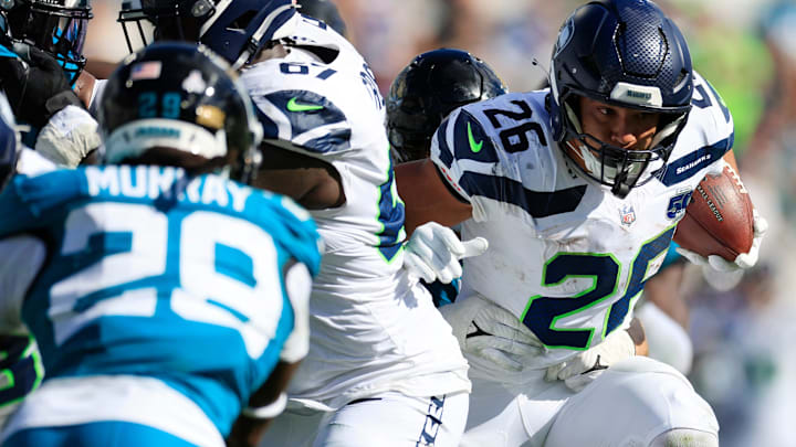 Seattle Seahawks running back Zach Charbonnet (26) rushes for yards during the fourth quarter of an NFL football matchup, Sunday, Oct. 12, 2025, at EverBank Stadium in Jacksonville, Fla. The Seahawks defeated the Jaguars 20-12.