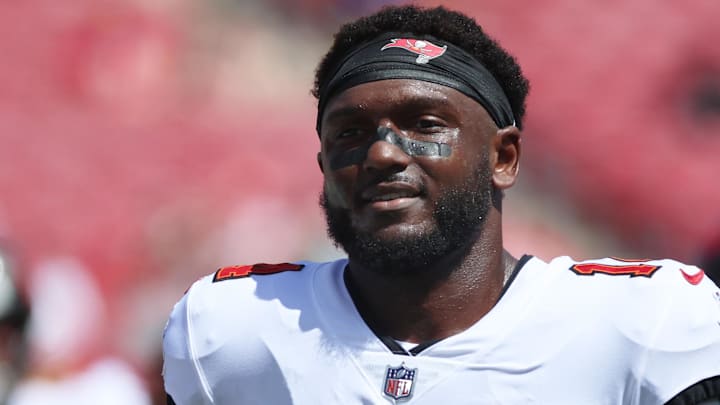 Sep 22, 2024; Tampa, Florida, USA;  Tampa Bay Buccaneers wide receiver Chris Godwin (14) works out prior to the game against the Denver Broncos at Raymond James Stadium. Mandatory Credit: Kim Klement Neitzel-Imagn Images
