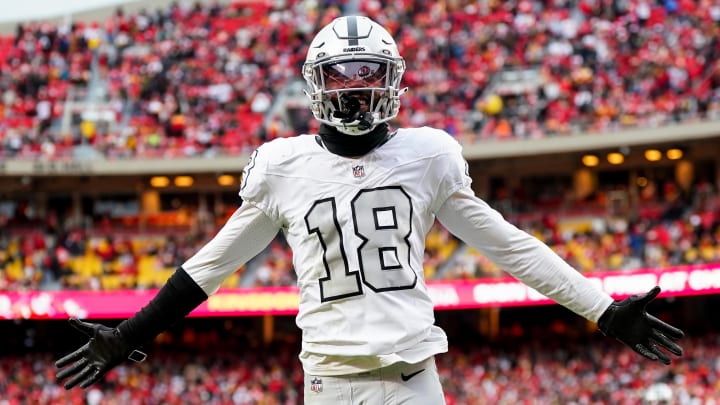 Dec 25, 2023; Kansas City, Missouri, USA; Las Vegas Raiders cornerback Jack Jones (18) interacts with the crowd after a play during the second half against the Kansas City Chiefs at GEHA Field at Arrowhead Stadium. Mandatory Credit: Jay Biggerstaff-USA TODAY Sports