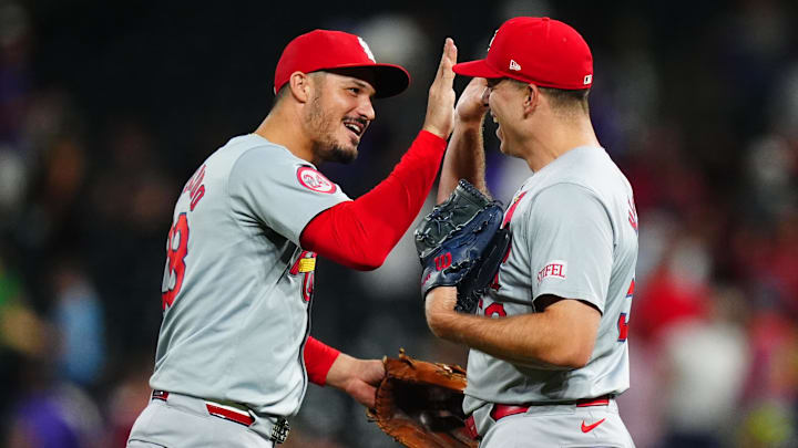 Sep 25, 2024; Denver, Colorado, USA; St. Louis Cardinals third base Nolan Arenado (28) and relief pitcher Ryan Helsley (56) celebrate defeating the Colorado Rockies at Coors Field. Mandatory Credit: Ron Chenoy-Imagn Images