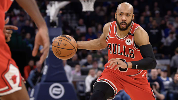 Feb 5, 2025; Minneapolis, Minnesota, USA; Chicago Bulls guard Jevon Carter (5) controls the ball against the Minnesota Timberwolves during the second quarter at Target Center. Mandatory Credit: Nick Wosika-Imagn Images