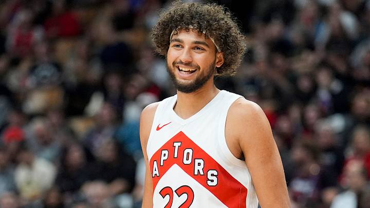 Oct 13, 2026; Toronto, Ontario, CAN;  Toronto Raptors forward Allen Graves (22) smiles during a break in the action against the New York Knicks during the first half at Scotiabank Arena.  Mandatory Credit: John E. Sokolowski-Imagn Images