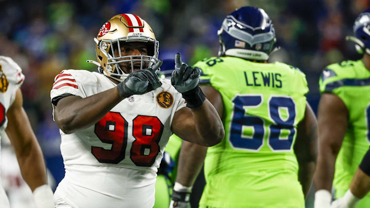 Nov 23, 2023; Seattle, Washington, USA; San Francisco 49ers defensive tackle Javon Hargrave (98) celebrates after a sack against the Seattle Seahawks during the second quarter at Lumen Field. Mandatory Credit: Joe Nicholson-Imagn Images