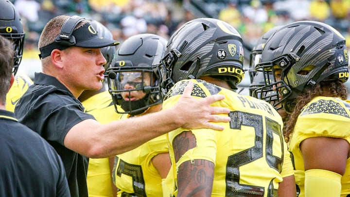 Oregon defensive coordinator Tosh Lupoi rallies the defense as the Oregon Ducks host Portland State in the Ducks    season opener Saturday, Sept. 2, 2023, at Autzen Stadium in Eugene, Ore.