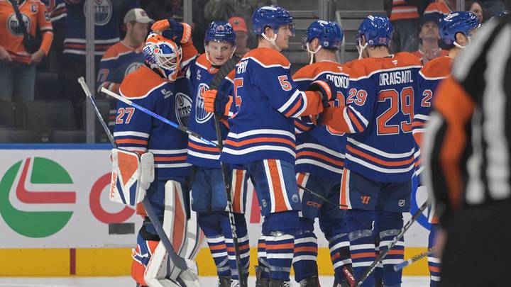 Oct 3, 2026; Edmonton, Alberta, CAN;  Edmonton Oilers goalie Devon Levi (27) and right winger Owen Michaels (43) celebrate their win over the Seattle Kraken during the third period at Rogers Place.  Mandatory Credit: Walter Tychnowicz-Imagn Images