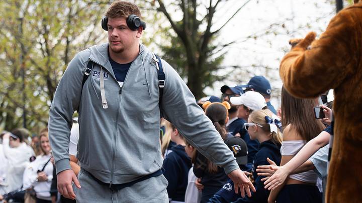 Penn State offensive lineman Cooper Cousins greets fans outside Beaver Stadium before the Blue-White game in 2025. Penn State offensive lineman Cooper Cousins greets fans outside Beaver Stadium before the Blue-White game in 2025.