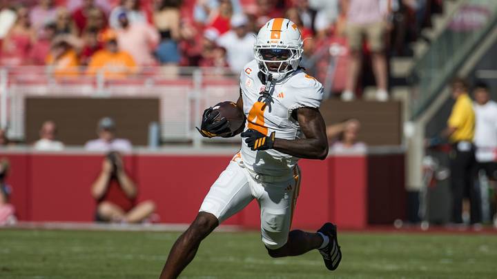 Oct 10, 2026; Fayetteville, Arkansas, USA;  Tennessee Volunteers wide receiver Mike Matthews (4) runs a reverse against the Arkansas Razorbacks during the first quarter at Donald W. Reynolds Razorback Stadium.  Mandatory Credit: Brett Rojo-Imagn Images