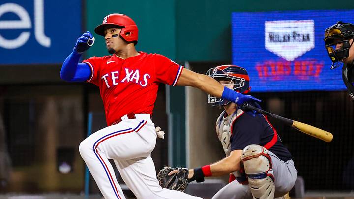 Oct 1, 2021; Arlington, Texas, USA; Texas Rangers third baseman Andy Ibanez (77) hits an rbi double during the second inning against the Cleveland Indians at Globe Life Field. Mandatory Credit: Kevin Jairaj-USA TODAY Sports Oct 1, 2021; Arlington, Texas, USA; Texas Rangers third baseman Andy Ibanez (77) hits an rbi double during the second inning against the Cleveland Indians at Globe Life Field. Mandatory Credit: Kevin Jairaj-USA TODAY Sports