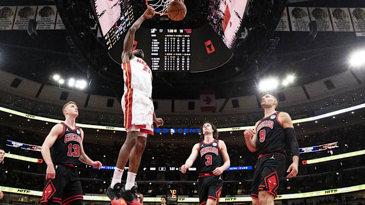 Apr 16, 2025; Chicago, Illinois, USA; Miami Heat forward Andrew Wiggins (22) dunks the ball