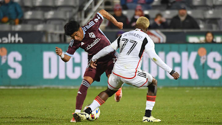 Apr 20, 2024; Commerce City, Colorado, USA; Colorado Rapids midfielder Omir Fernandez (11) and FC Dallas forward Bernard Kamungo (77) fight for the ball during the second half at Dick's Sporting Goods Park. Mandatory Credit: Christopher Hanewinckel-USA TODAY Sports