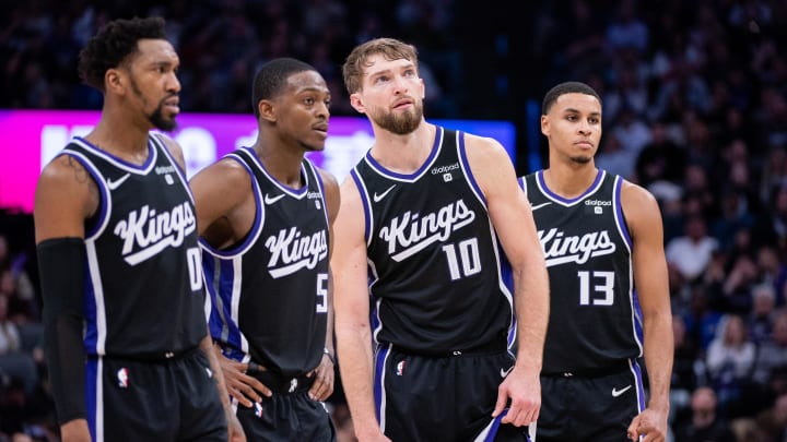 Jan 5, 2024; Sacramento, California, USA; Sacramento Kings guard Malik Monk (0) and guard De'Aaron Fox (5) and forward Domantas Sabonis (10) and forward Keegan Murray (13) look on during a free throw during the fourth quarter against the Toronto Raptors at Golden 1 Center. Mandatory Credit: Ed Szczepanski-USA TODAY Sports Jan 5, 2024; Sacramento, California, USA; Sacramento Kings guard Malik Monk (0) and guard De'Aaron Fox (5) and forward Domantas Sabonis (10) and forward Keegan Murray (13) look on during a free throw during the fourth quarter against the Toronto Raptors at Golden 1 Center. Mandatory Credit: Ed Szczepanski-USA TODAY Sports