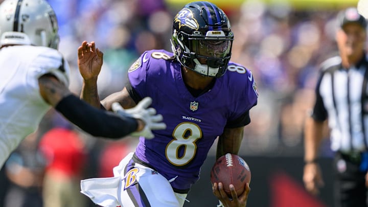 Sep 15, 2024; Baltimore, Maryland, USA; Baltimore Ravens quarterback Lamar Jackson (8) runs with the ball during the first half against the Las Vegas Raiders at M&T Bank Stadium. Sep 15, 2024; Baltimore, Maryland, USA; Baltimore Ravens quarterback Lamar Jackson (8) runs with the ball during the first half against the Las Vegas Raiders at M&T Bank Stadium.
