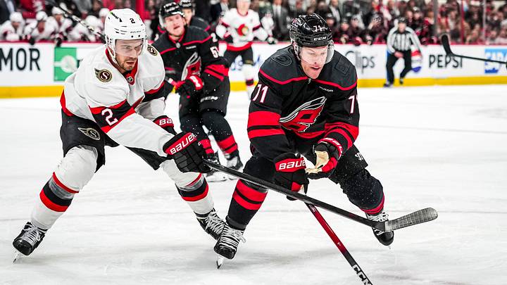 Artem Zub battling for the puck against Carolina Hurricanes forward Taylor Hall in the first game in round one of the Stanley Cup Finals Artem Zub battling for the puck against Carolina Hurricanes forward Taylor Hall in the first game in round one of the Stanley Cup Finals