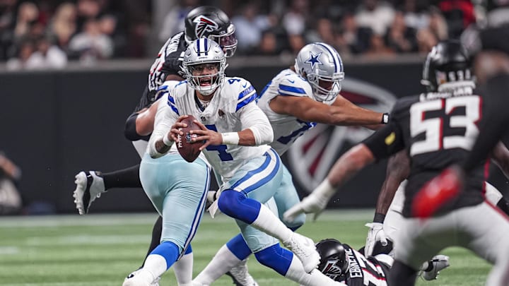 Dak Prescott runs out of the pocket against the Atlanta Falcons during the second half at Mercedes-Benz Stadium. 