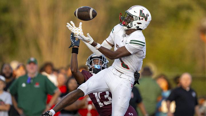 Lawrence North High School sophomore Monshun Sales (1) makes a catch in the end zone to score while being defended by Lawrence Central High School junior DJ Summers (13) during the first half of an IHSAA varsity football game, Friday, Aug. 23, 2024, at Lawrence Central High School. Lawrence North High School sophomore Monshun Sales (1) makes a catch in the end zone to score while being defended by Lawrence Central High School junior DJ Summers (13) during the first half of an IHSAA varsity football game, Friday, Aug. 23, 2024, at Lawrence Central High School.