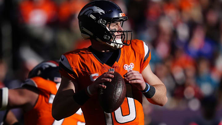 Dec 21, 2025; Denver, Colorado, USA; Denver Broncos quarterback Bo Nix (10) drops back to pass against the Jacksonville Jaguars during the first half at Empower Field at Mile High. Mandatory Credit: Ron Chenoy-Imagn Images