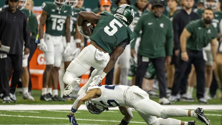 Nov 24, 2023; Detroit, Michigan, USA; Penn State Nittany Lions cornerback Daequan Hardy (25) tackles Nov 24, 2023; Detroit, Michigan, USA; Penn State Nittany Lions cornerback Daequan Hardy (25) tackles