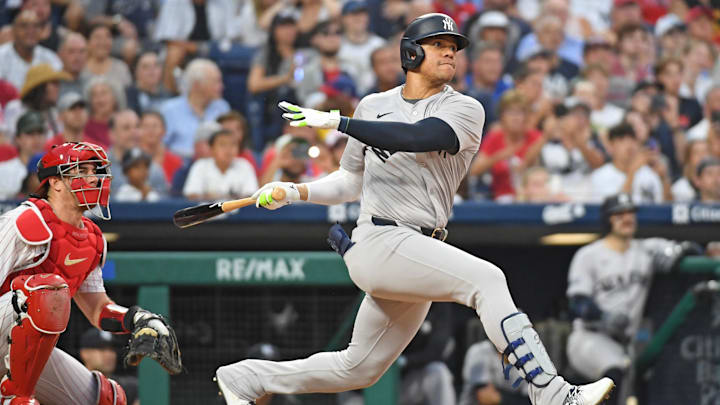 Jul 29, 2024; Philadelphia, Pennsylvania, USA;  New York Yankees outfielder Juan Soto (22) hits a two-RBI double against the Philadelphia Phillies during the fifth inning at Citizens Bank Park.