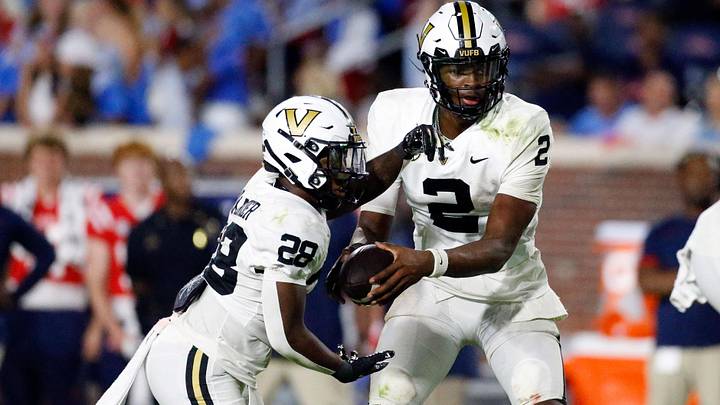Vanderbilt Commodores quarterback Walter Taylor hands the ball off to running back Sedrick Alexander during the second half Vanderbilt Commodores quarterback Walter Taylor hands the ball off to running back Sedrick Alexander during the second half